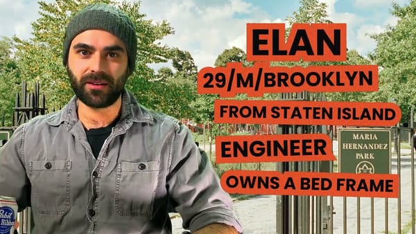 The Bushwick Bachelor sits in a beanie holding a can of Pabst Blue Ribbon.